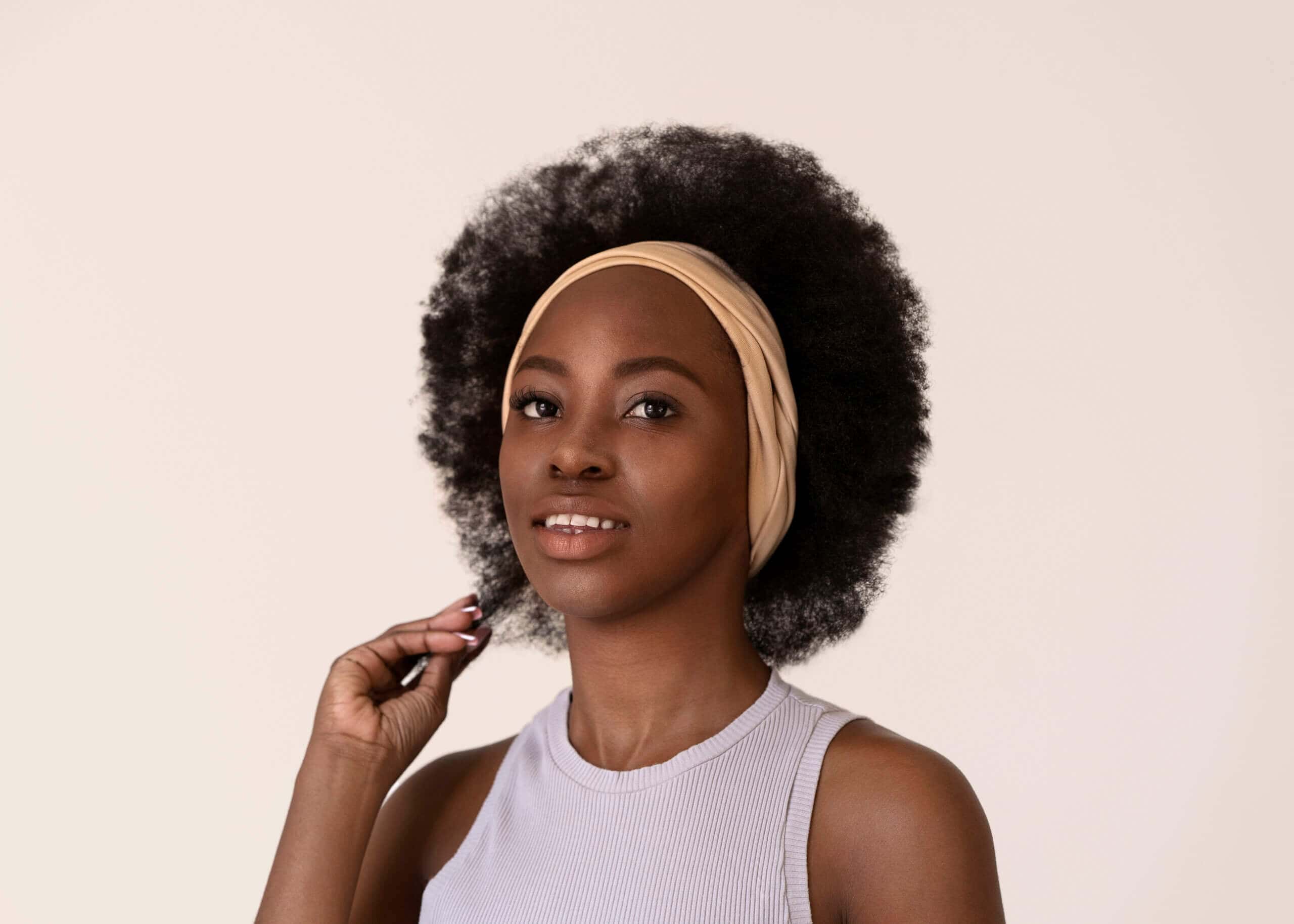 smiley woman with afro hair posing side view scaled 1 | Ivoire & Ben La Boutique