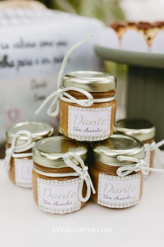 Small jars of caramel candy tied with white ribbon