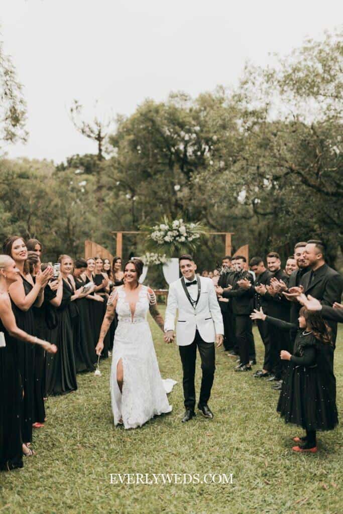 String quartet playing wedding ceremony exit songs as couple walks back down aisle at elegant wedding