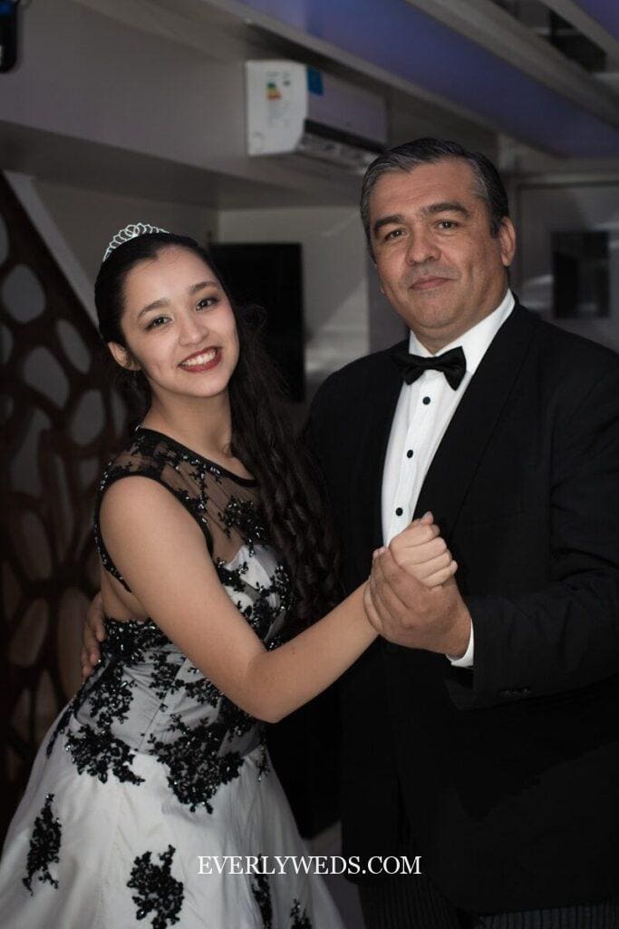 Bride and father at wedding reception planning father daughter dance song checklist