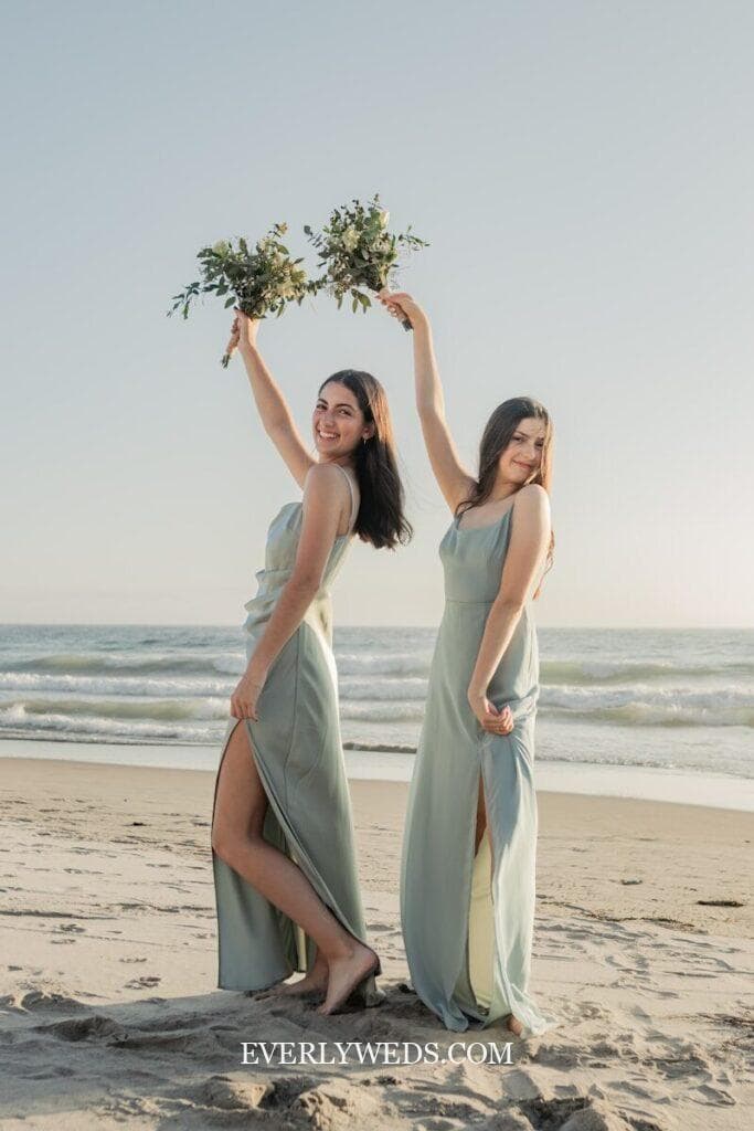 bridesmaid holding rosemary lavender herb bundle as non traditional wedding bouquet alternative tied with ribbon