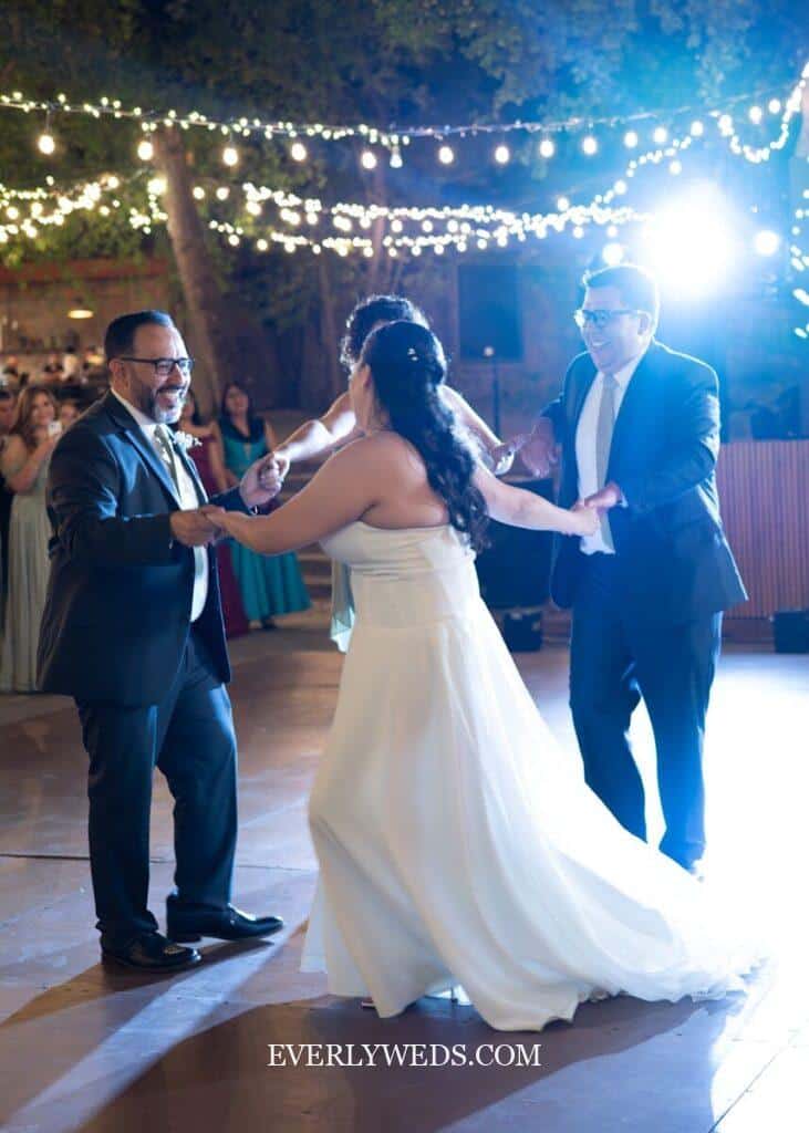 Father and daughter laughing and dancing to upbeat song at 