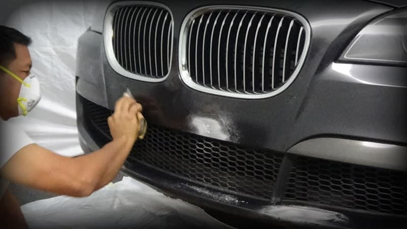 instructor repairing scuffed bumper