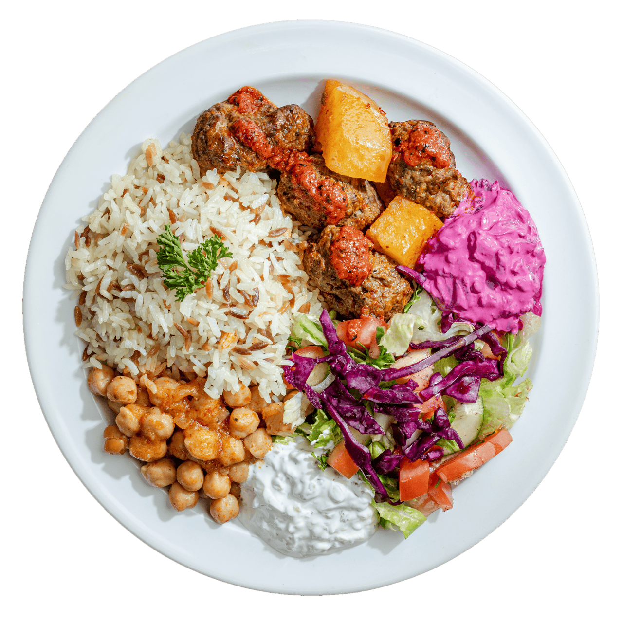 A plate with rice, chickpeas, meatballs, pineapple, purple slaw, salad, white sauce, and a sprig of parsley on top.