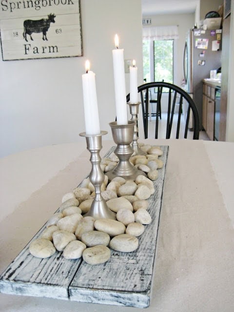 1. Rustic Rock and Distressed Wood Centerpiece