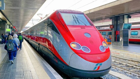 Trenitalia Frecciarossa high-speed train at a platform in Rome.