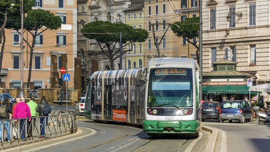 Line 8 tram moving through Largo Argentina in Rome.