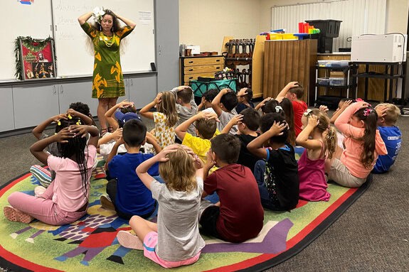 Image of Edie Stanley Teaching at Murdock Elementary School with students following her movements