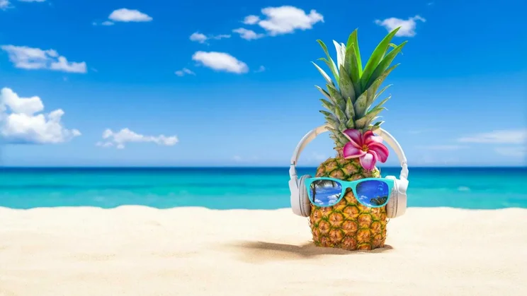 Pineapple on a beach with sunglasses (1)