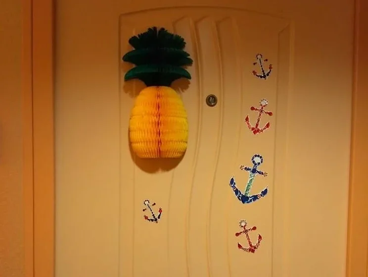 Pineapple on a cruise ship door