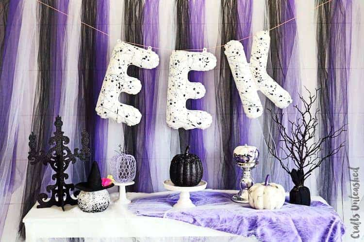 2. Eek Backdrop – DIY Halloween Party Decorations