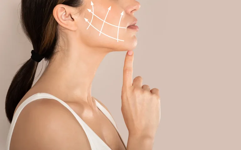 A side profile of a woman with contouring lines, illustrating the benefits and procedure steps from your guide to cheek fillers.