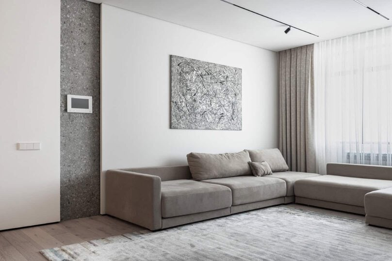 Modern minimalist living room with neutral tones, sleek design, and large windows allowing natural light, perfect for contemporary interior design and architecture art styles.