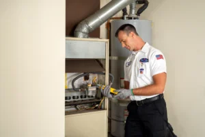 A Bell Brothers technician in uniform expertly performs a Furnace Tune-Up in Dublin, backed by our No Surprise Guarantee and trusted service.
