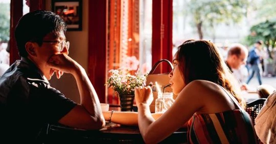 He's asking ice breaker questions to keep her captivated
