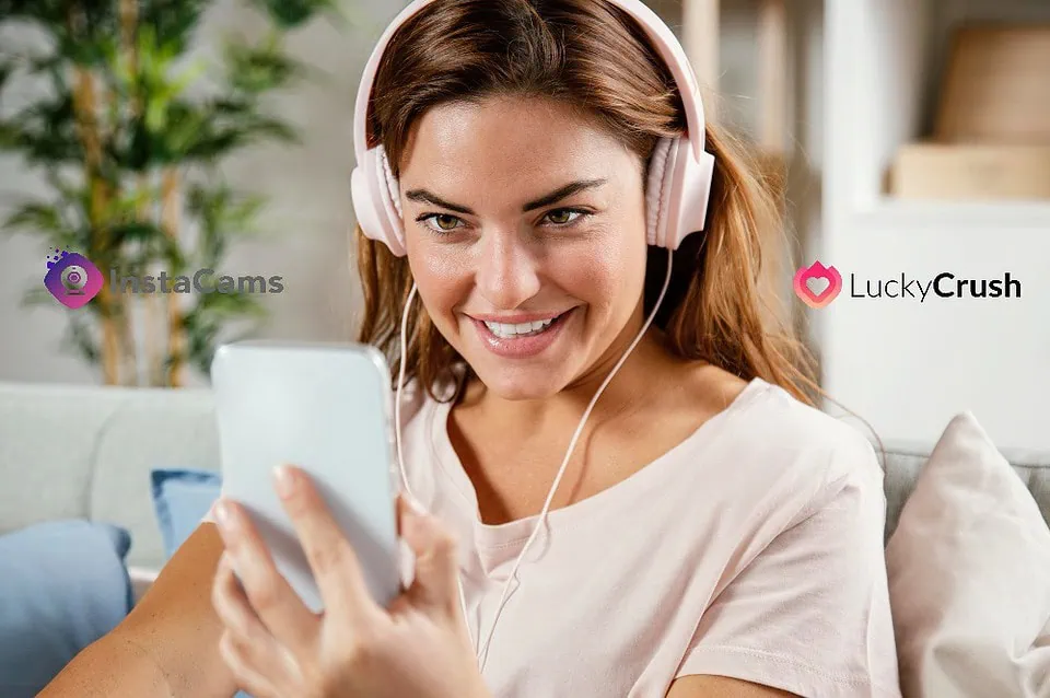 One young adults enjoy a lively video chat, on a phone in a cozy living room showcasing the fun of online connections.