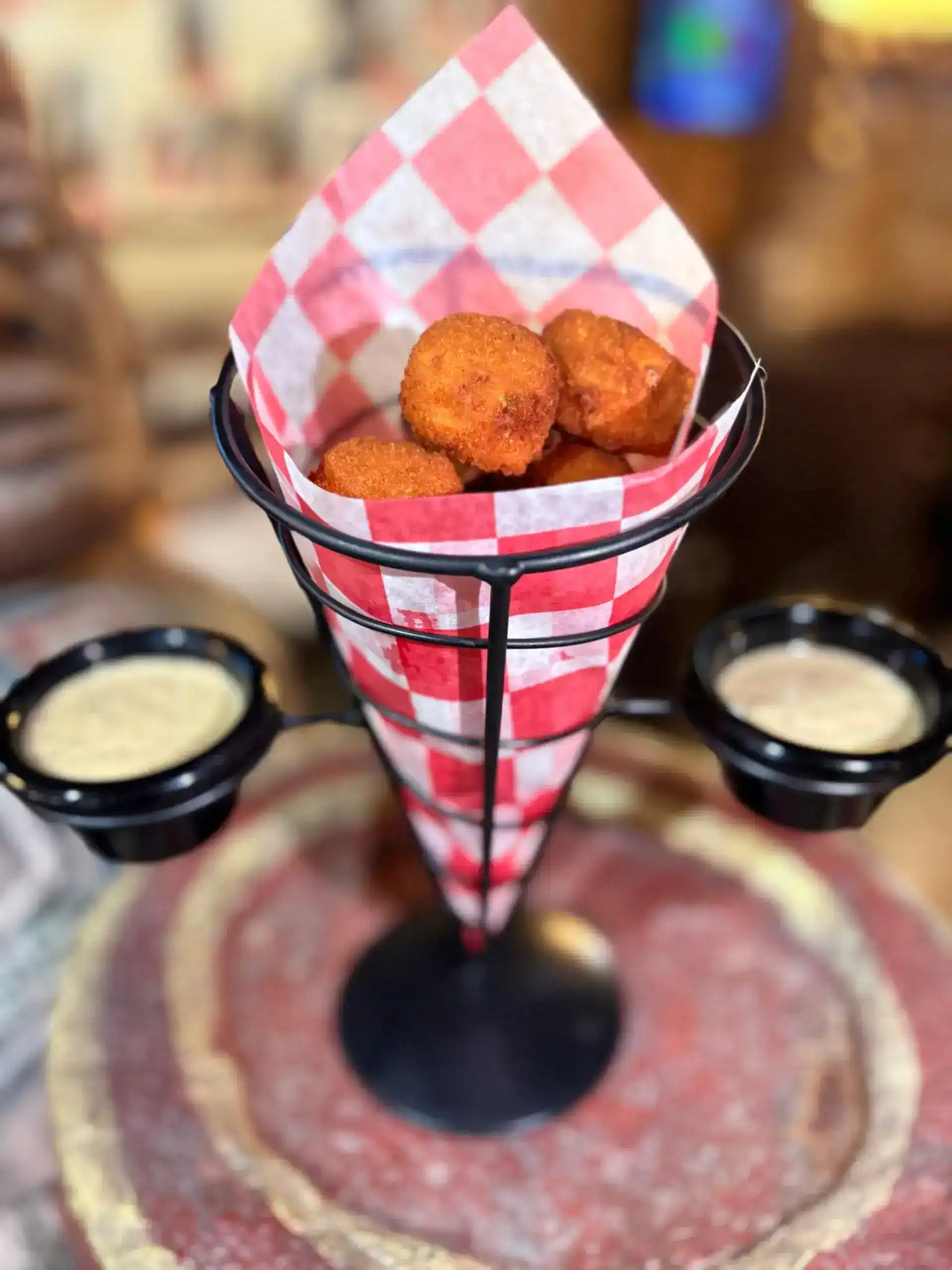 Crispy chicken bites served in a basket with dipping sauces at Casa Tequila Mexican Grill & Cantina.
