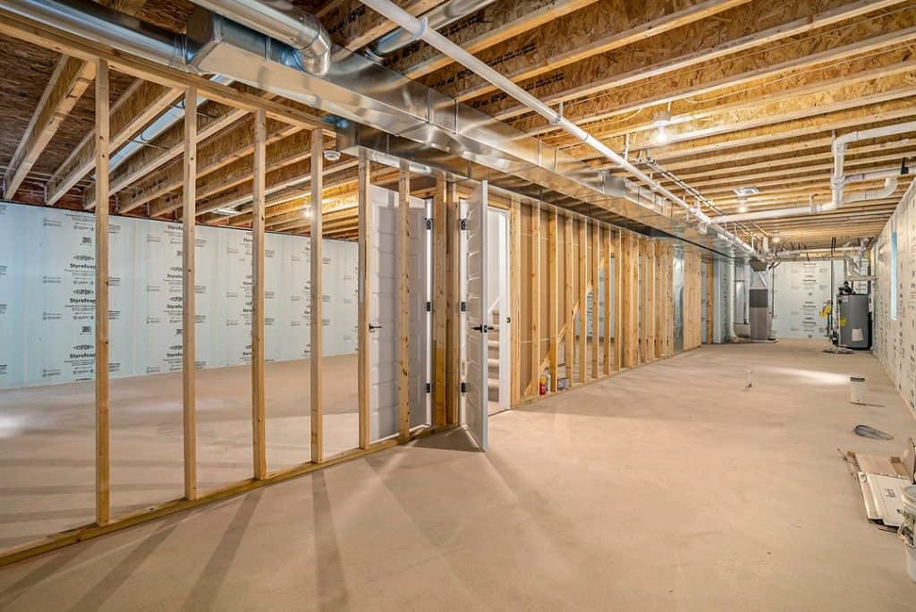 Interior framing of a custom home under construction by BuildWest.