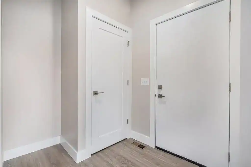 Clean white interior doors in a modern home hallway.