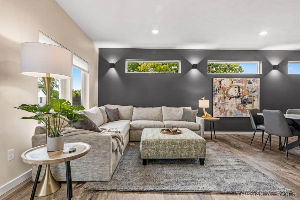 Spacious modern living room with large sectional sofa and contemporary decor.