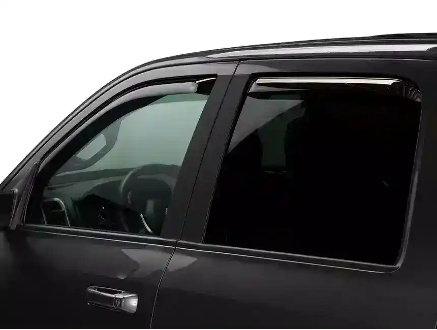 Close-up of a black SUV window with tinted glass, showcasing professional tinting for privacy and UV protection.