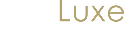 JustLuxe logo celebrating 20 years of luxury, designed for a dark header template.