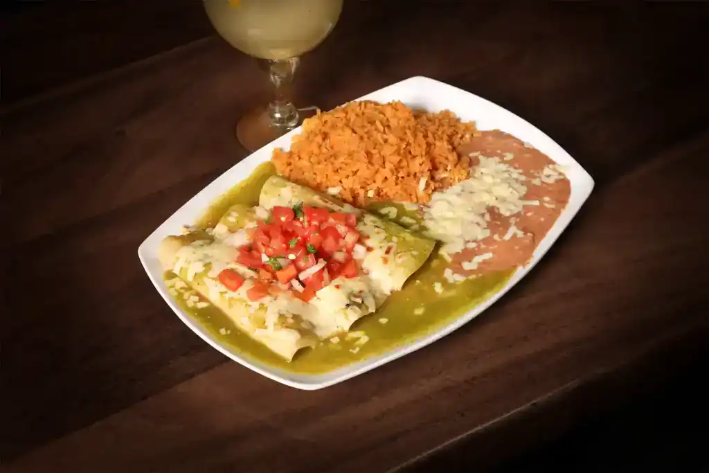 Authentic Mexican meal featuring rice, refried beans, and fresh toppings.