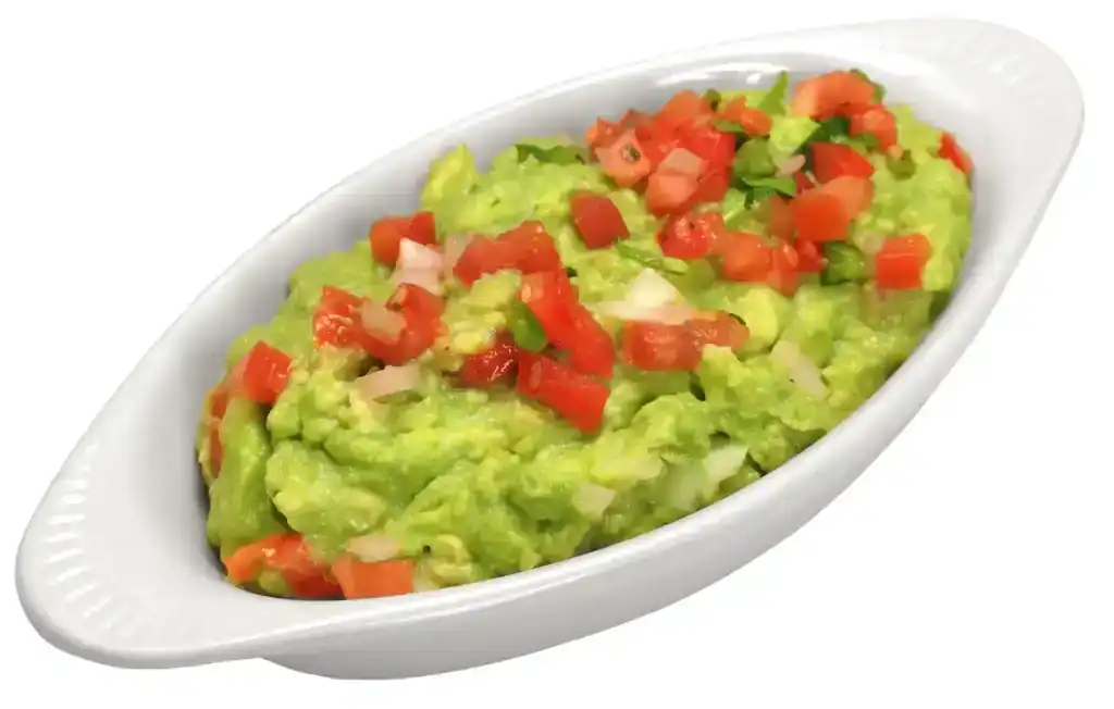 Guacamole with diced tomatoes served in a white oval bowl at Casa Tequila Mexican Grill & Cantina, C.