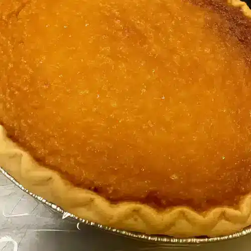 Sweet potato pie with a golden, smooth filling and a flaky crust, perfect for dessert or special occasions. Made with fresh ingredients and traditional recipes for authentic Southern flavor.