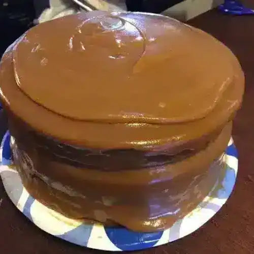 Delicious caramel cake with rich, smooth caramel frosting layered on moist cake, perfect for special occasions or everyday indulgence.