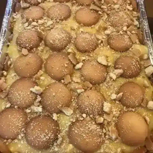 Delicious homemade banana pudding with vanilla wafers and whipped topping.