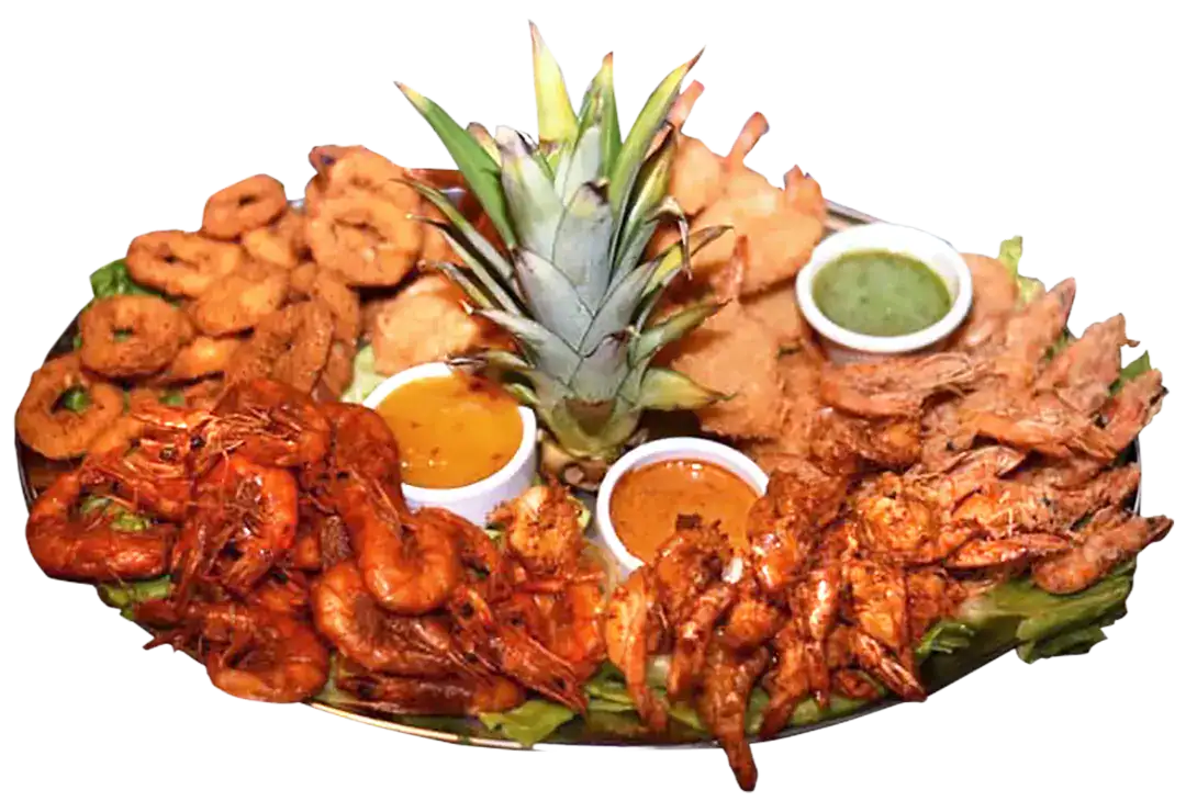 Seafood platter with shrimp, lobster, and pineapple garnish for seafood lovers.
