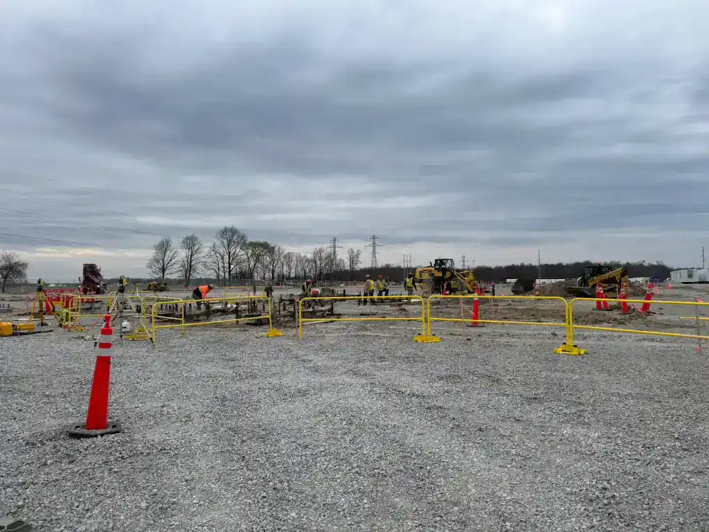 Substation construction site in Northeast Indiana with safety barriers and equipment.