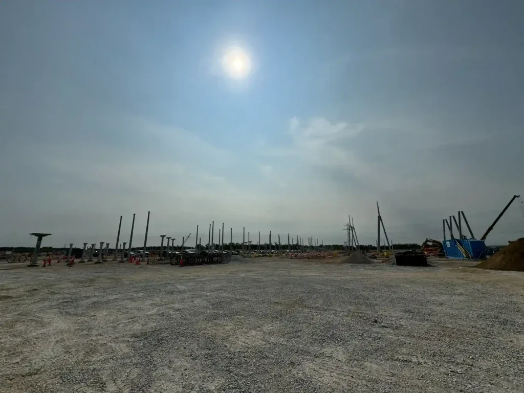 Substation construction in Northern Indiana under bright sunlight.
