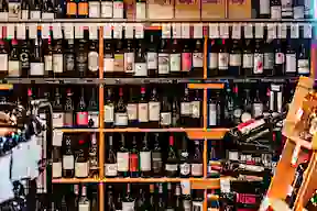 Full shelf of wine in the dusty cellar