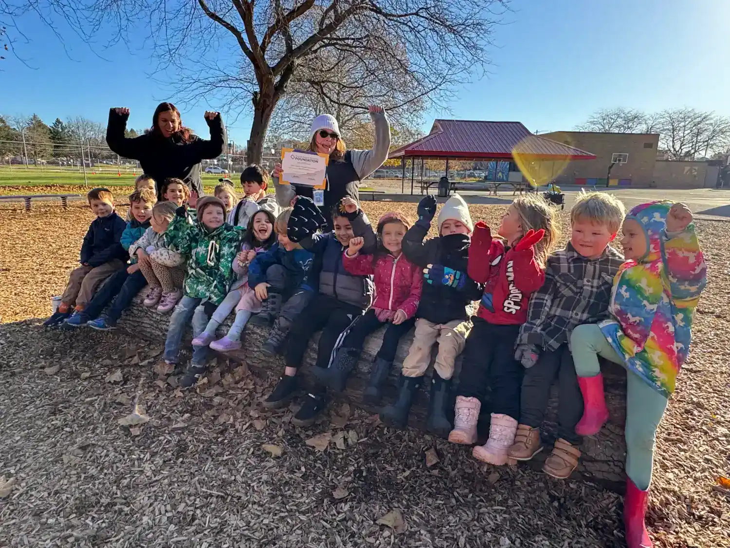 Group of children and adults enjoying outdoor activity at GHSF.