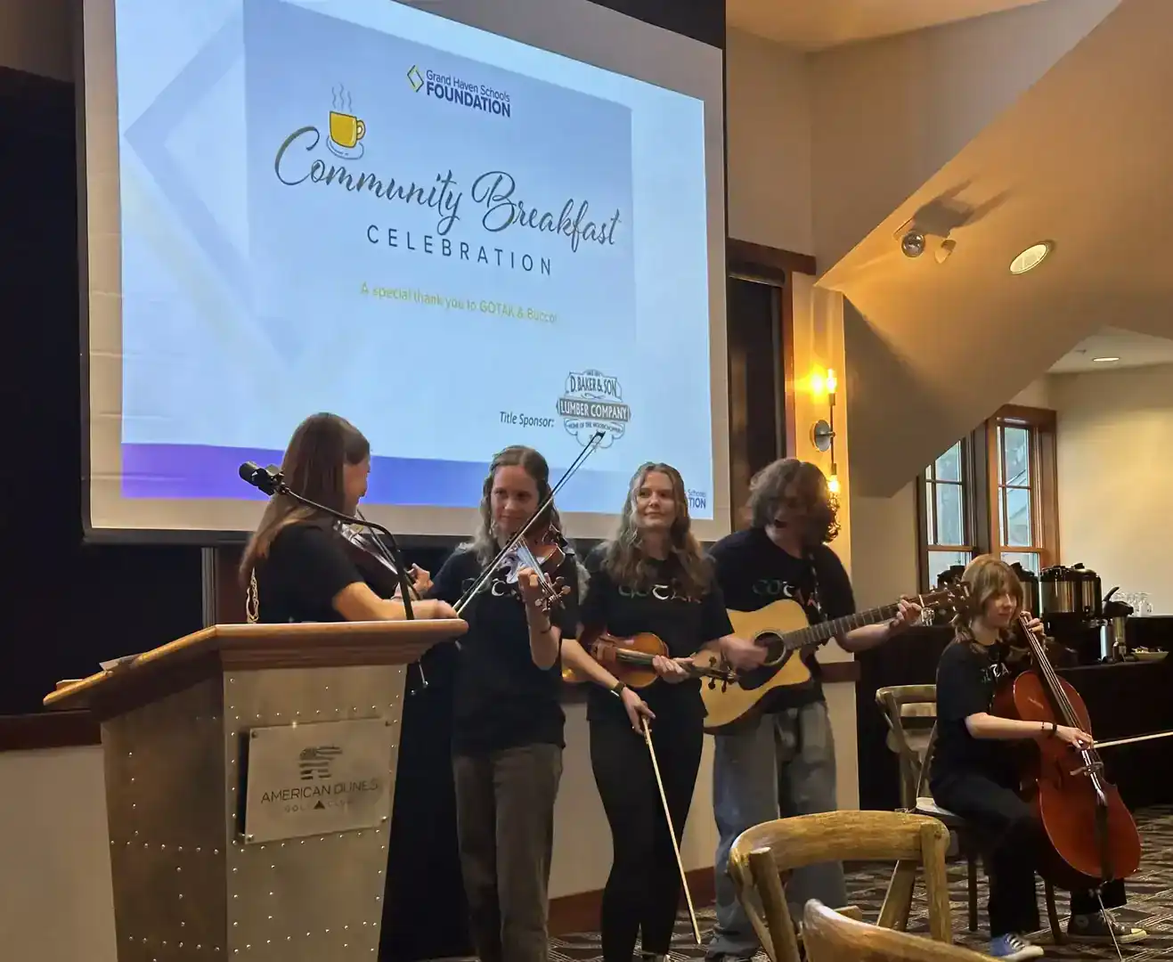 Group of young musicians performing at GHSF community breakfast event.