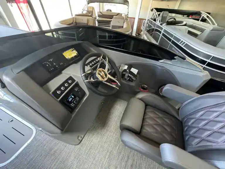 High-end yacht cockpit with modern controls and plush seating at Hall's Sport Center.