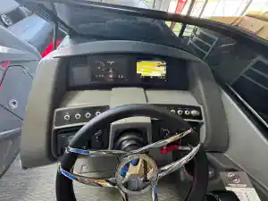 Modern bus dashboard with digital display and GPS navigation system.