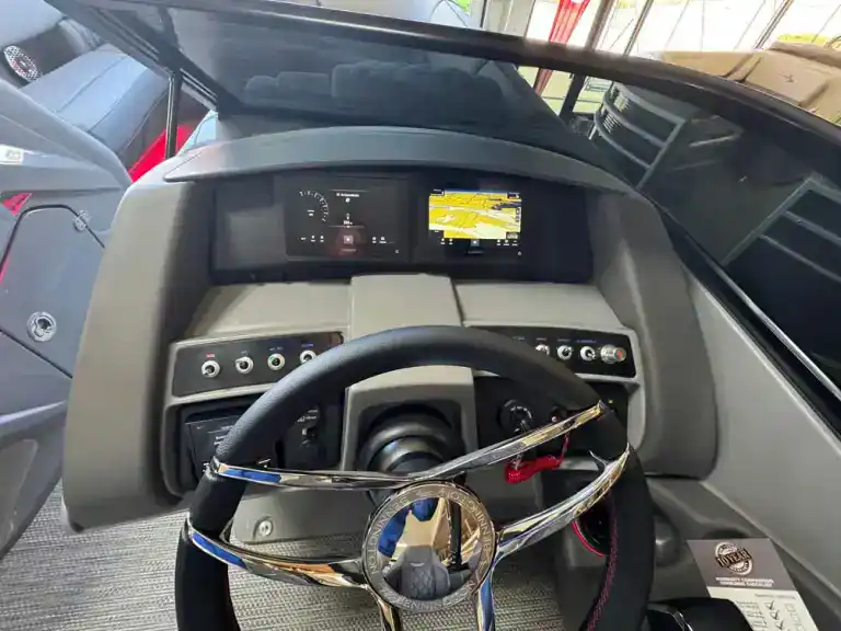 Modern bus dashboard with digital display and GPS navigation system.