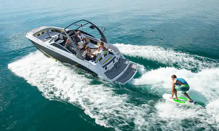 Bright, exciting image of a speedboat with people enjoying water sports, showcasing Hall's Sport Center's aquatic activities.