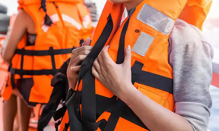 Bright orange life jackets for boating and water activities, ensuring safety and comfort.
