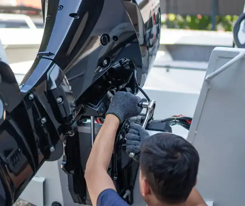 Outboard motor maintenance and repair services at Hall's Sport Center. Expert techs ensuring smooth boating experiences.