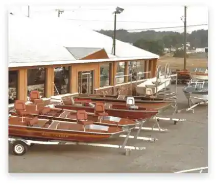 Boats lined up outside Hall's Sport Center, showcasing fishing boats and watercraft for sale.