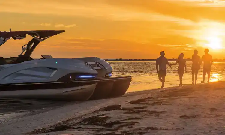 Ultra-luxury yacht docked on lake shoreline with friends enjoying sunset water views.