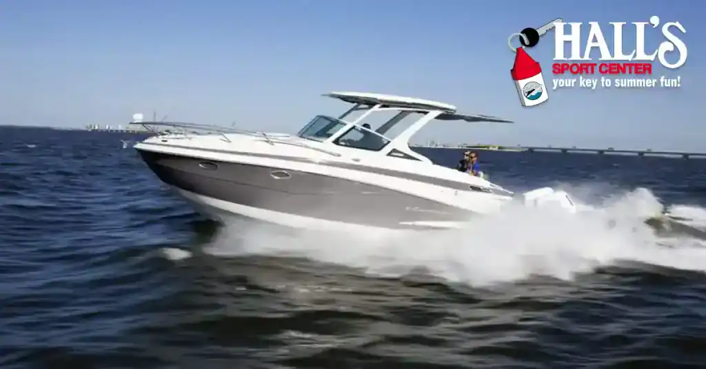 Boat on water at Hall's Sport Center, promoting summer fun.
