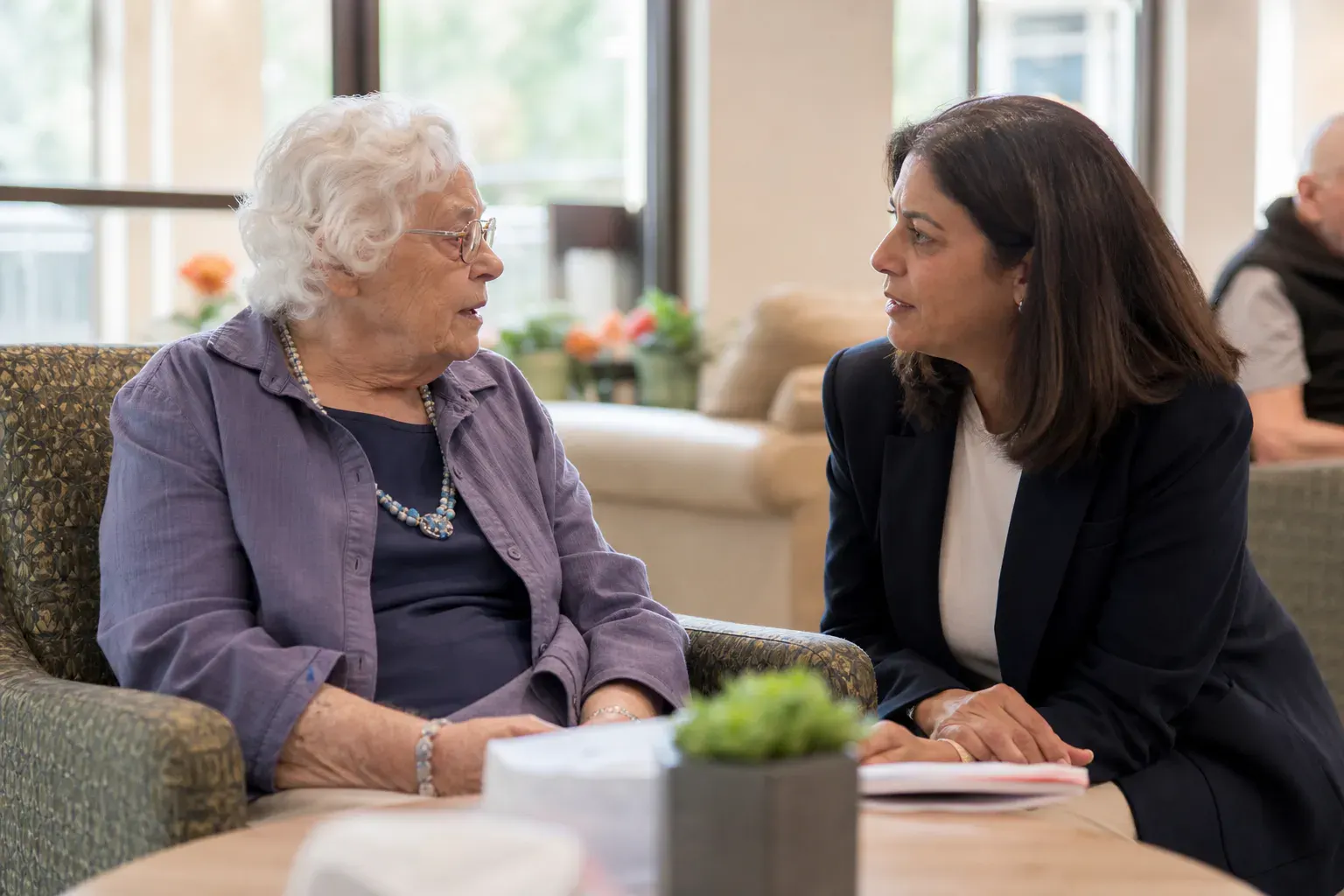Advocate speaking with a nursing home resident about a care complaint