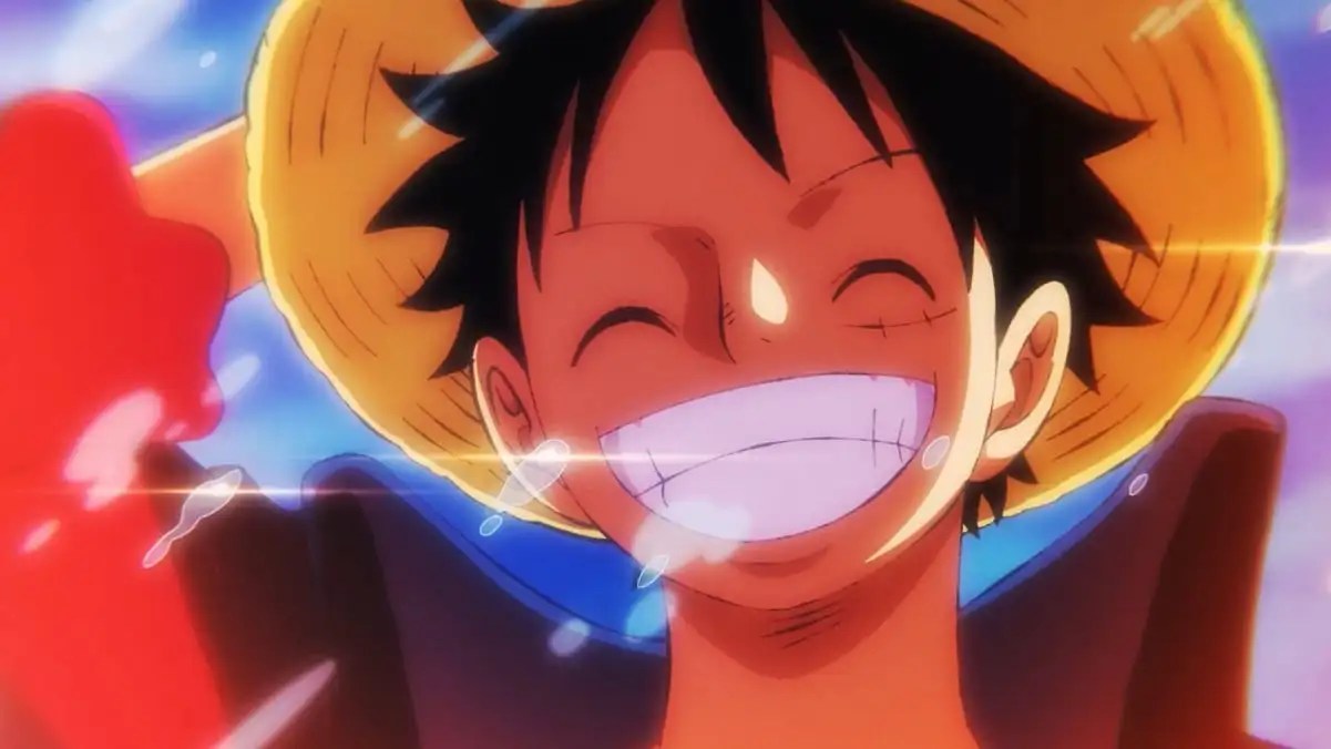 Monkey D. Luffy alzando su sombrero de paja con una sonrisa