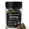 Zkittlez cannabis flower in a clear jar with matte black lid, front label showing Net Wt 3.5 g and CA THC symbol, with two frosty buds displayed on pure white — Moonrock Online Shop.