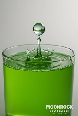 acro water droplet hitting lime-green Moonrock CBD Seltzer, forming ripples; droplet reflection shows a calm lake—symbolizing balance